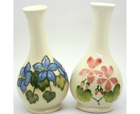 Two Moorcroft cream ground vases, H: 16 cm. P&P Group 2 (£18+VAT for the first lot and £3+VAT for subsequent lots)Condition R