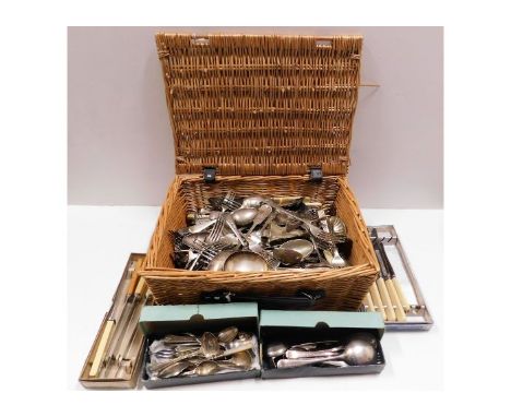 A basket of mostly silver plated flatware &amp; other items