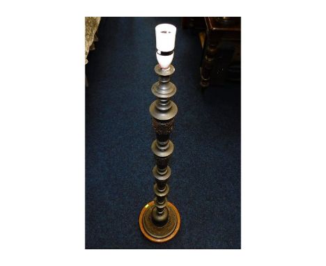 A cast metal standard lamp with decorative Oriental style dragon pattern 53in high 