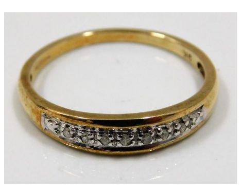 A 9ct gold ring set with small diamonds size Q/R 2.1g