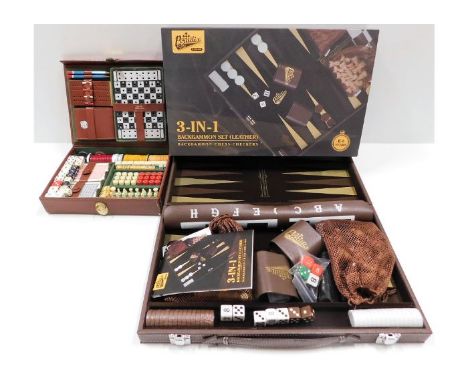 A boxed leather Backgammon &amp; games set with a travel games compendium