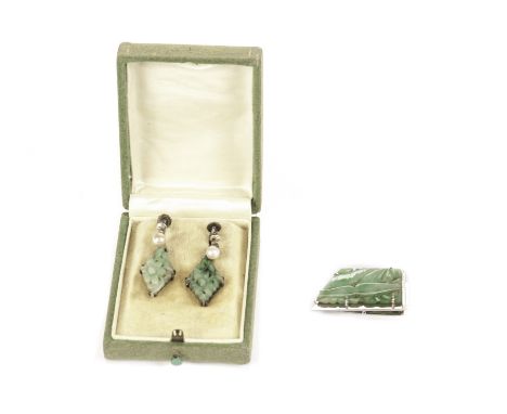 A pair of Art Deco Chinese jade and pearl earrings and a brooch, the drop earrings with a diamond shaped carved and pierced p