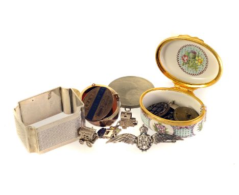 A small collection of silver and jewellery, including a 1960s shell cameo, a silver RAF pilots badge, a silver napkin ring, a