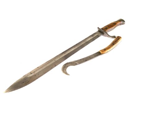 A WWI German sword bayonet, marked Erfurt W15, in metal scabbard with leather carry case, together with a curved antler handl