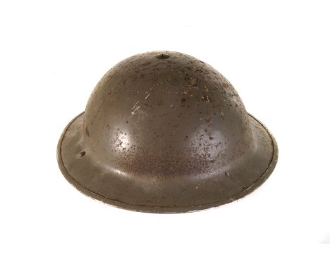 A WWII brodie style helmet, in traditional green, with leather lining, plus material strap, AF