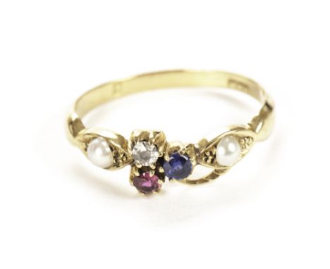 A pretty gold and gem set ring, having a diamond, ruby and sapphire to centre and a pearl to either side