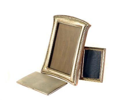 A collection of silver photograph frames,  the largest 33cm high, together with a 1950s silver engine turned cigarette case, 