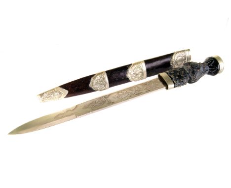 A Scottish military Dirk, having white metal crown terminal, with thistle decorated 29cm blade, with scabbard having white me