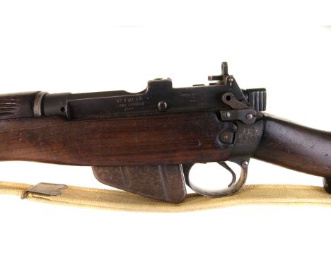 A WWII Lee Enfield No.4 MkI* rifle, made by Long Branch, dated 1943, the .303 calibre rifle with  spike bayonet marked with b