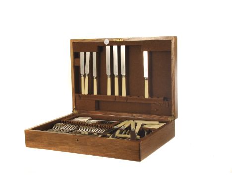 An associated canteen of silver plated flatware, presented in an oak case bearing a plaque inscribed 'Presented to Sgt. Inst.