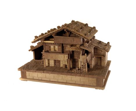 A 19th century Swiss musical box,  modelled as a Swiss chalet, playing three tunes , 'La dame Blanche', 'The Blue Danube' and