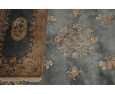 A large 20th century chinese wool carpet,  with central design in muted pastel tones, together with another smaller simlar ex