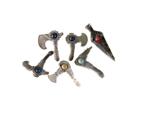 A set of six nordic style sword and axe badges, possibly Nazi related, each having a hardstone style stone mounted to centre,