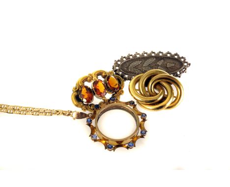 A small collection of 19th century jewellery,  including a silver machine made brooch, a three stone citrine brooch in scroll