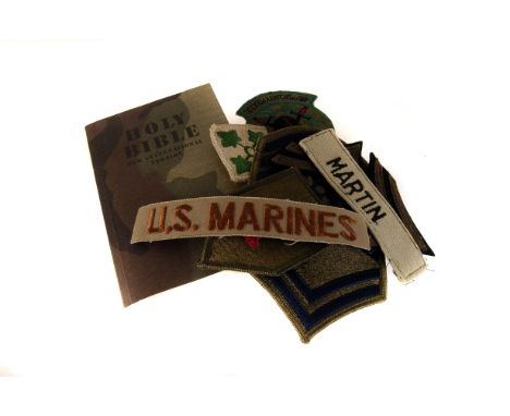 An assortment of various cloth badges, including US Army, US Marine, Naval, continental etc, plus a bible (parcel)