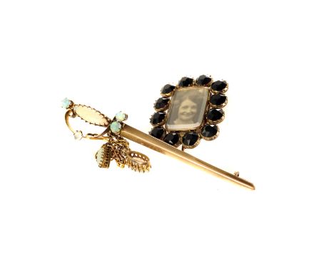 A 15ct gold and oval sword bar brooch, together with a french jet mounted portrait / mourning brooch (2)
