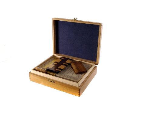 A collection of whist markers, from an assortment of makers and in various woods, with playing cards including besique sets, 