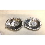 Pair of silver-plated floral dishes with a petal and leaf design and textured details. The dishes