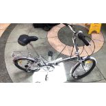 Vintage Milan Explorer Bicycle: Features a charming aluminum frame, rear rack, and adjustable seat.
