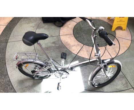Vintage Milan Explorer Bicycle: Features a charming aluminum frame, rear rack, and adjustable seat.
