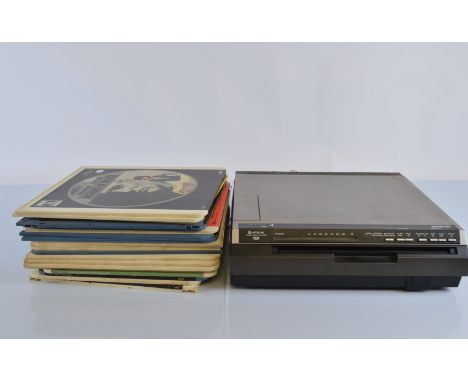 A Hitachi Video Disk player, together with a collection of disks