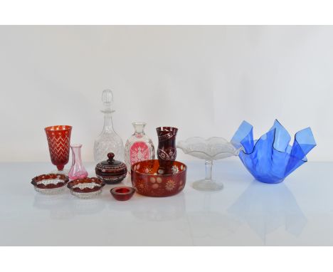 A collection of cranberry glass, including overlaid etched design floral bowl, 18cm diameter, two plain glass scalloped and s