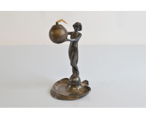 A WMF pewter figural table light, modelled as an Art Nouveau maiden in flowing robes on an organic and sinuous lined base sup