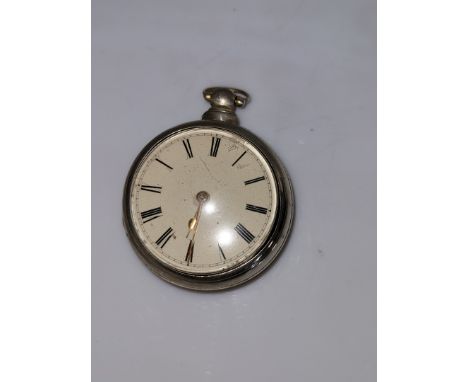 An 18th century silver pair cased pocket watch, enamel dial with Roman numerals, movement by Rob Bowers of Chester with paper