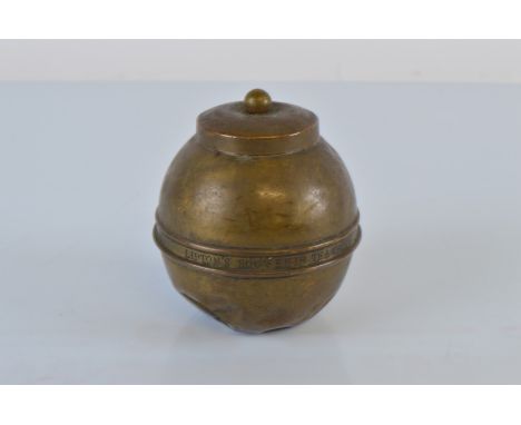 A brass Lipton British Empire Exhibition 1924 tea caddy, 12cm tall