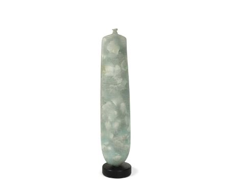 § Peter Hayes (1946-), a narrow bottle-form vase, of solid construction, the 'celadon' composition body with ceramic inclusio