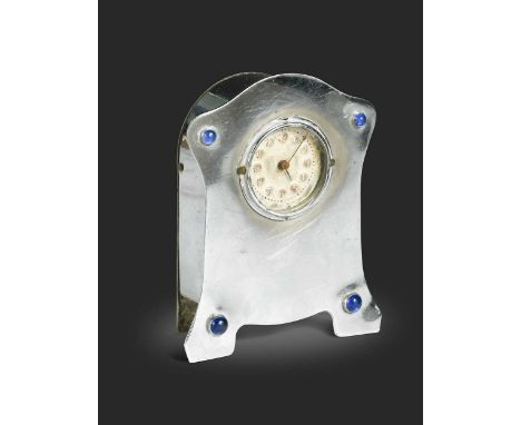 In the manner of Liberty & Co., a small chromed mantel clock, with blue glass cabochons to each corner, the embossed silvered