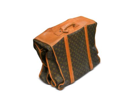 Louis Vuitton, a monogrammed canvas and leather suit carrier, folding with Vachetta leather trim, metal ribs to one side, two