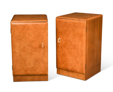 A pair of Art Deco maple bedsides, each with cupboard door opening to reveal a single drawer within64.5 x 37 x 37.5cmThe hand