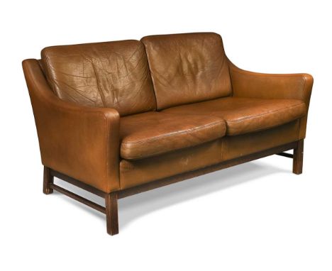 A Danish mid-century brown leather two-seat sofa, with down-swept arms raised on stained square section legs74 x 130 x 76cm