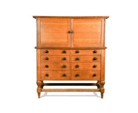 A substantial Arts & Crafts oak collector's cabinet,  designed by J. T. McGaw and craftsman made in St Leonards Forest, Horsh