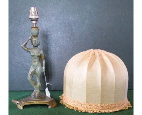 A circa 1920's Art Nouveau gilt and green patinated spelter table lamp, Swedish with Stjarmetall stamp, with fringed shade.