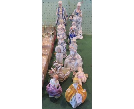 A pair of 20th century Continental porcelain figures, modelled as a dandy and beau, together with twelve other Continental fi