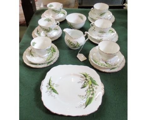 A Melba bone china part-tea service, comprising: six cups, saucers, tea plates, cake plate, milk jug and sugar bowl, each tra