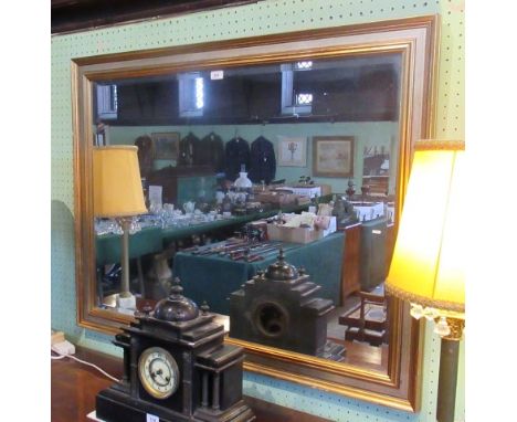 A large contemporary gilt framed wall mirror with rectangular bevelled plate, 90 x 105cm.