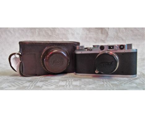 A Leica camera, the chrome body no. 243540, fitted with a Summar lens no. 219493 in leather case.