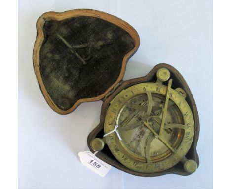 An 18th century-style brass marine compass in a hide covered outer case.