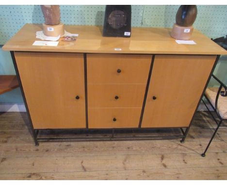 A contemporary cast metal and beech veneered sideboard, the rectangular top over three central drawers flanked by cupboards, 