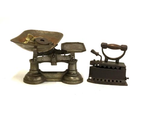 A set of vintage kitchen scales, with weights; together with a box iron 