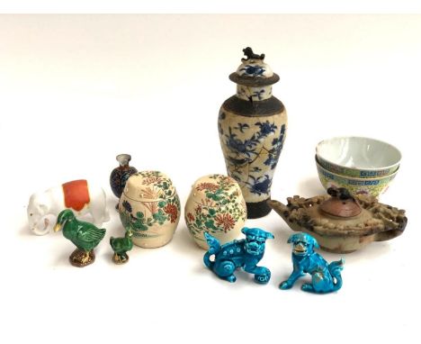 A mixed lot to include a carved soapstone teapot, the lid surmounted by a bird; a pair of Japanese porcelain pots in the shap