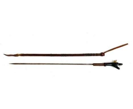 An early 20th century leather horse whip with concealed steel hunting spike, the handle with carved horn terminal in the form