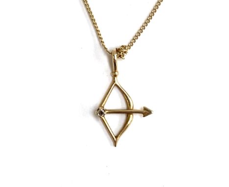 A 9ct gold necklace with a Sagittarius bow and arrow pendant, 1.4g 