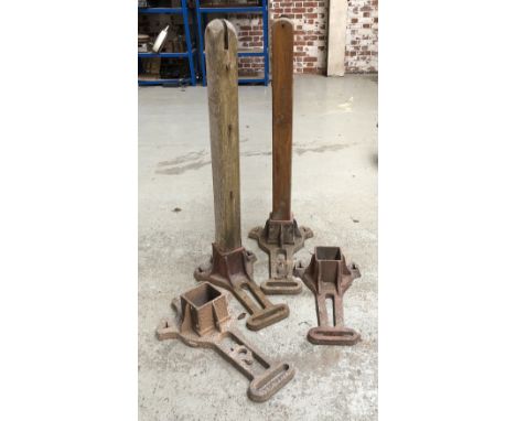 A set of vintage cast iron tennis net posts 