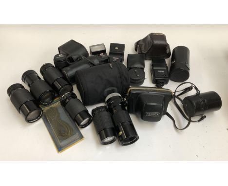 A quantity of photographic equipment, to include, Chinon 20-17mm lens, Canon 70-210mm lens, Camera cases, lens cases, lens ca