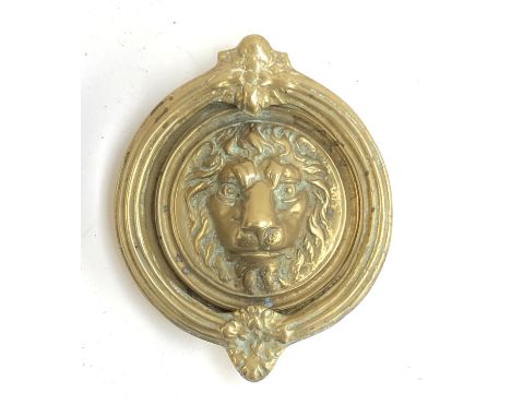 A heavy brass lion mask door knocker, 16cmL 