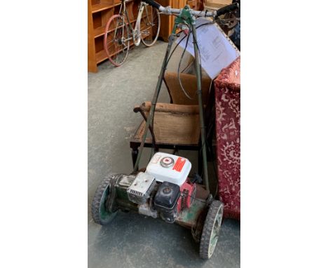 A vintage petrol lawnmower by Lloyd's of Letchworth